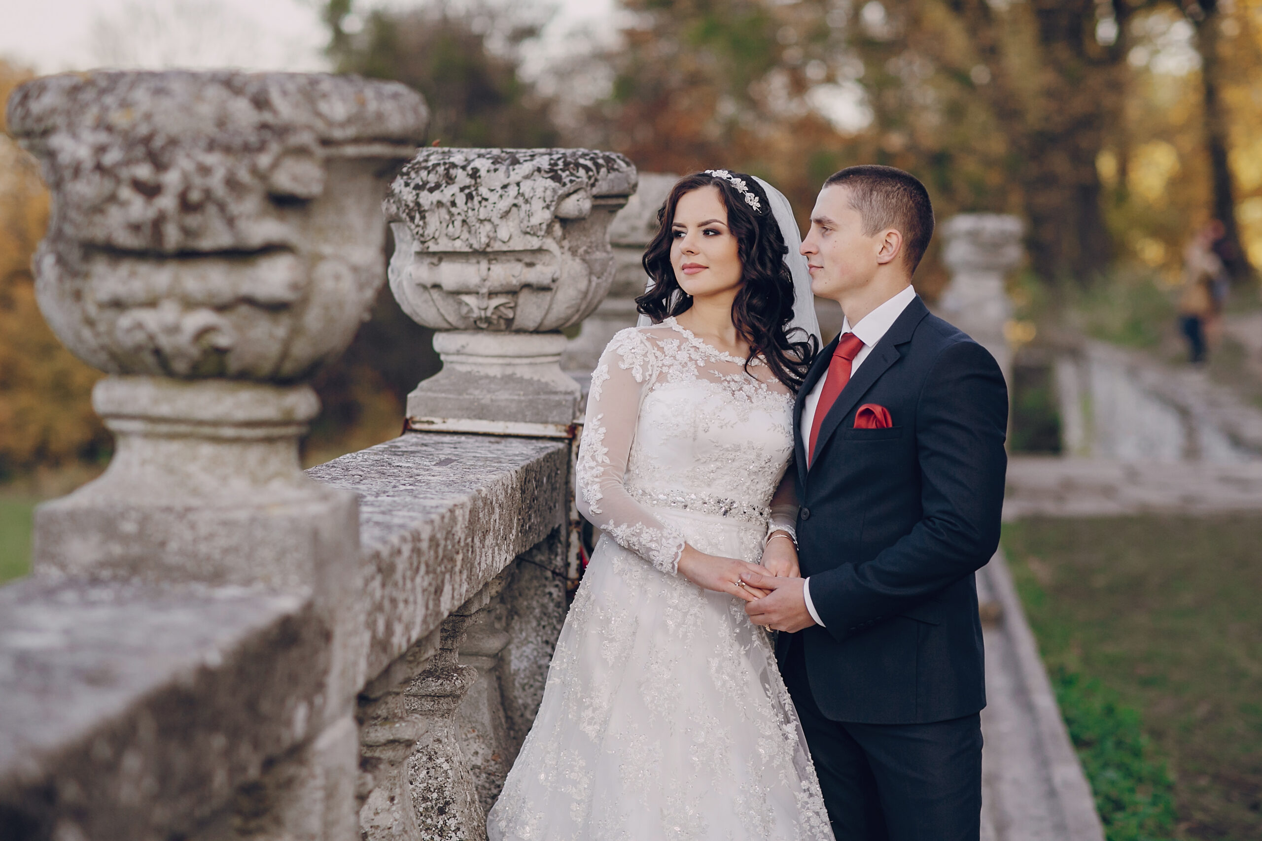 beautiful wedding couple celebrating their wedding day in autumn